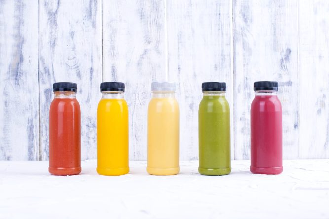 Organic cold-pressed raw vegetable juices in glass bottles. Vitamin and healthy food. Copy space.,