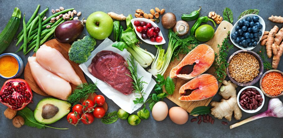 Balanced diet food background. Organic food for healthy nutrition, superfoods, meat, fish, legumes, nuts, seeds and greens