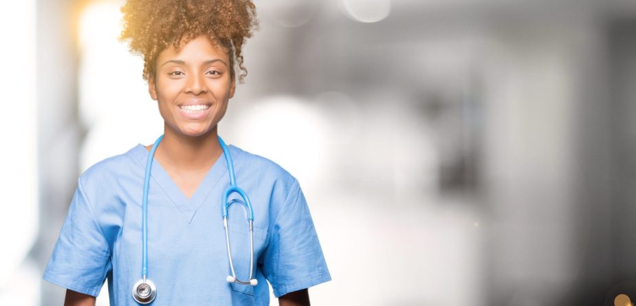 Young african american doctor woman over isolated background Hands together and fingers crossed smiling relaxed and cheerful. Success and optimistic