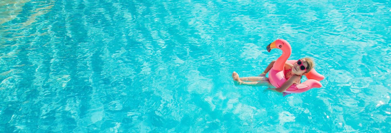 the child swims and dives in the pool. Selective focus.