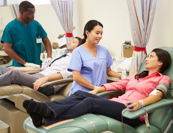 Loving Generous Blood Donors Making Donation In Hospital