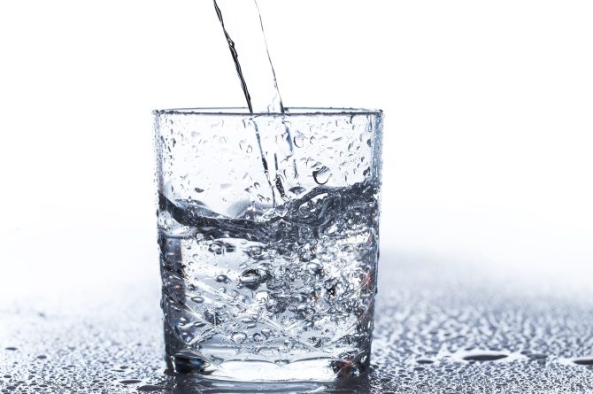 Glass with water on the table